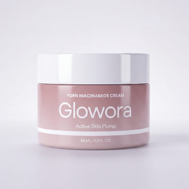Roze pot PDRN Niacinamide Crème met witte deksel op lichte achtergrond
