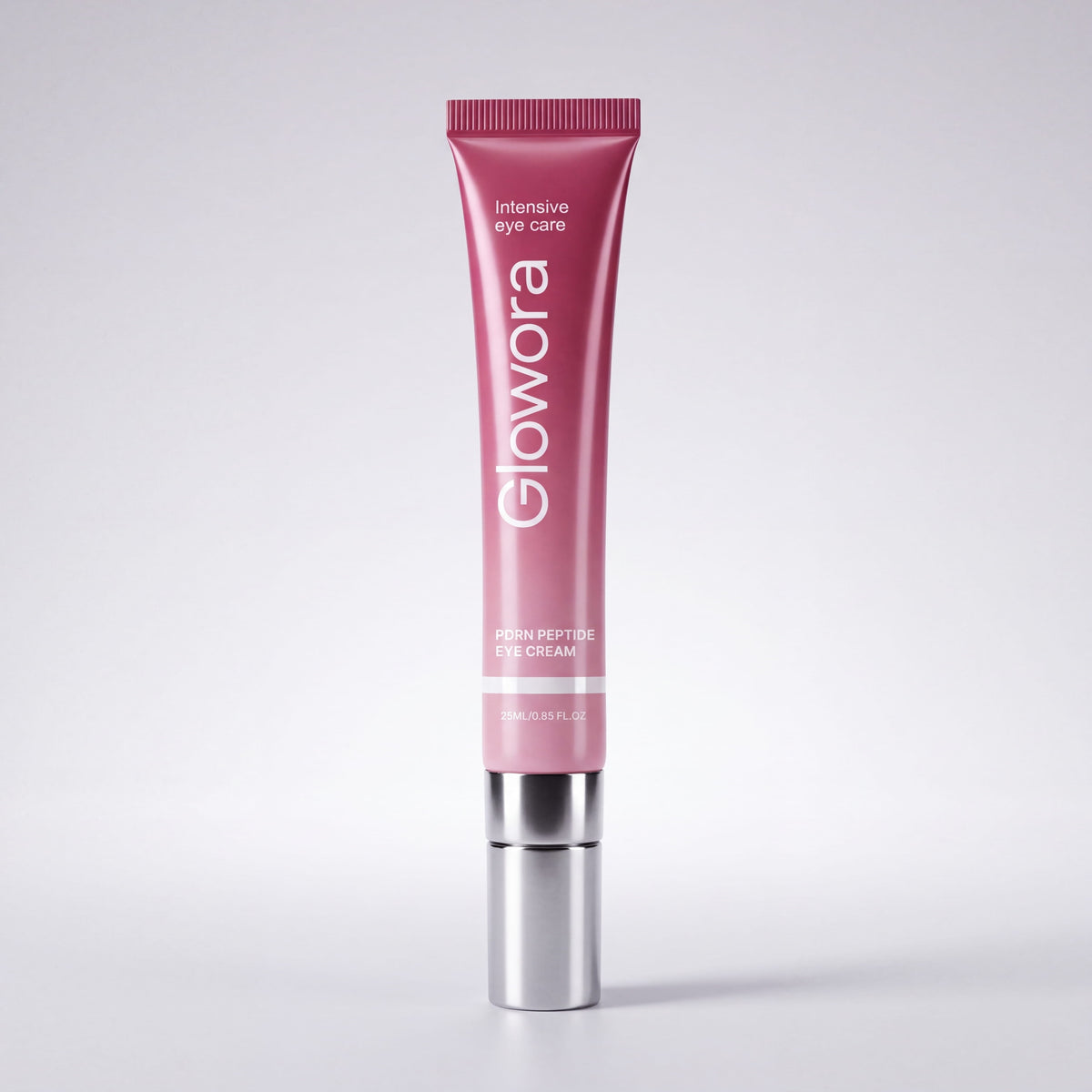Roze PDRN Peptide Oog Crème tube met zilveren applicator op lichte achtergrond